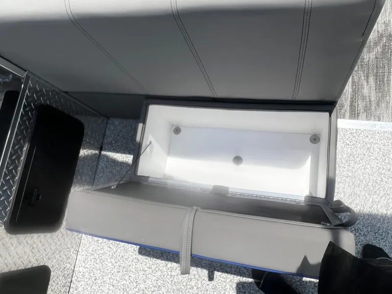 Slide: The Image of 2023 Angler Qwest 8522 Pro Family Fish boat storage compartment with cushioned seat. - 11