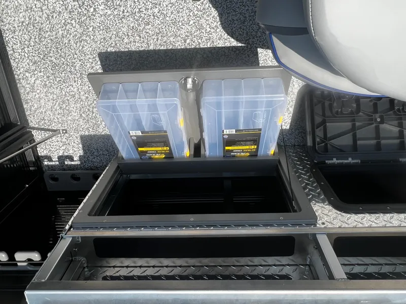 Slide: The Image of 2023 Angler Qwest 8522 Pro Family Fish tackle storage compartments. - 16