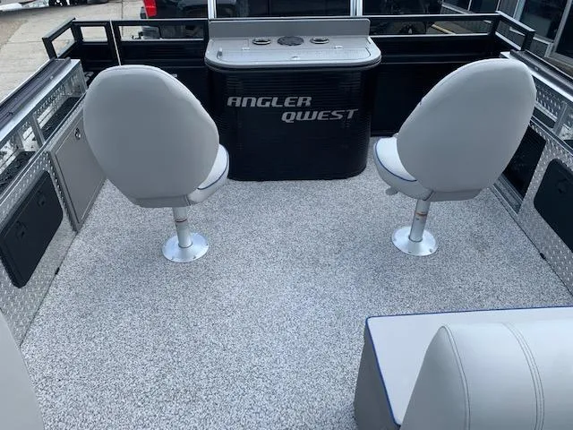 Slide: The Image of 2023 Angler Qwest 8522 Pro Family Fish boat interior with seating and storage. - 21