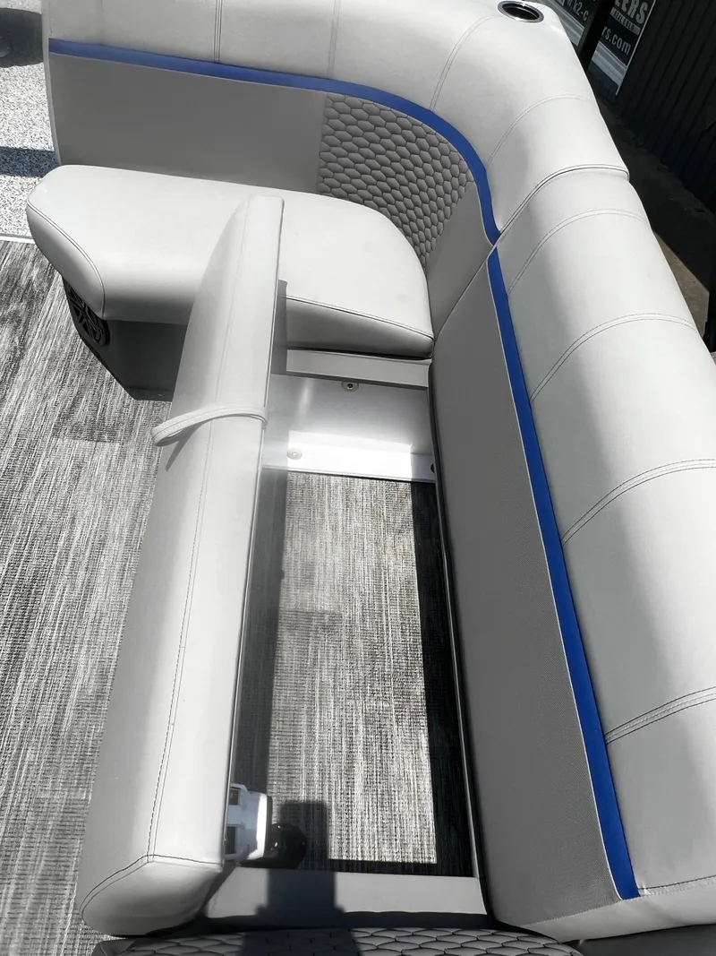 Slide: The Image of 2023 Angler Qwest 8522 Pro Family Fish boat seating with blue accent. - 6