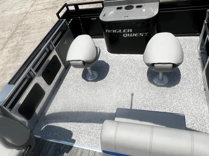 Slide: The Image of 2023 Angler Qwest 8522 Pro Family Fish boat interior with seating and fishing station. - 9