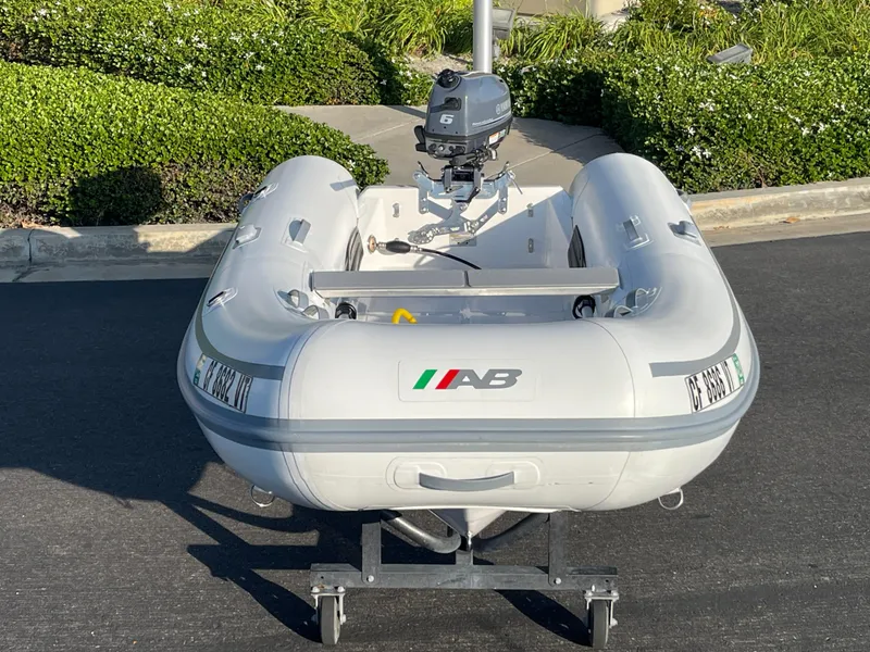 Slide: The Image of 2019 AB Inflatables Navigo 9 VS inflatable boat with outboard motor on trailer. - 12