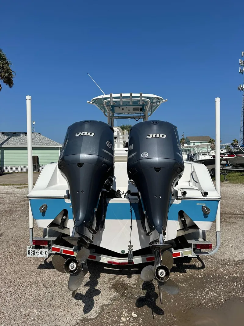 Slide: The Image of 2021 Sportsman Open 282 Center Console boat with twin 300 horsepower engines. - 2