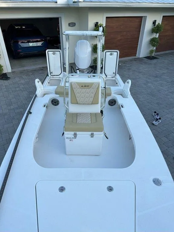 Slide: The Image of 2022 Blacktip Boatworks 18 Flats boat in driveway, top view. - 12