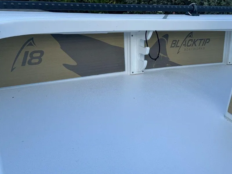 Slide: The Image of 2022 Blacktip Boatworks 18 Flats deck with logo and model number. - 15