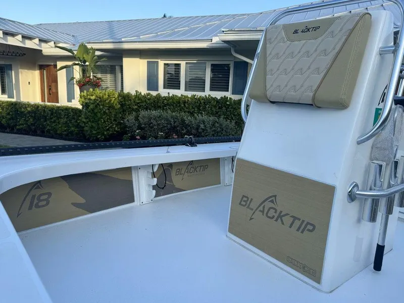 Slide: The Image of 2022 Blacktip Boatworks 18 Flats boat, interior view with seating and branding. - 16