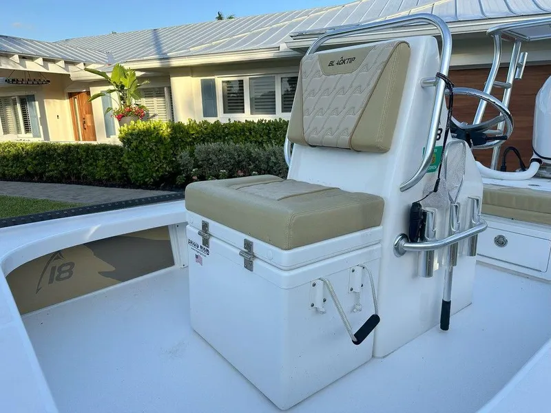 Slide: The Image of 2022 Blacktip Boatworks 18 Flats boat with cushioned seating and storage. - 17