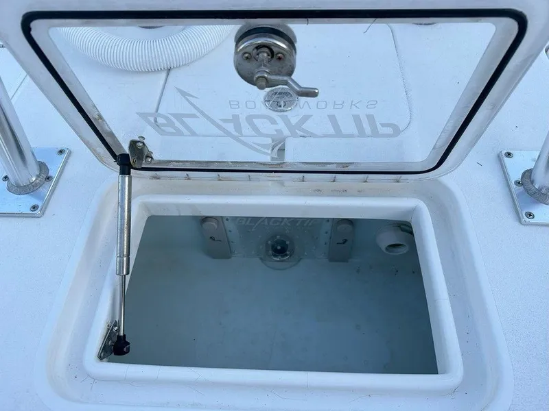 Slide: The Image of 2022 Blacktip Boatworks 18 Flats livewell with open lid. - 4