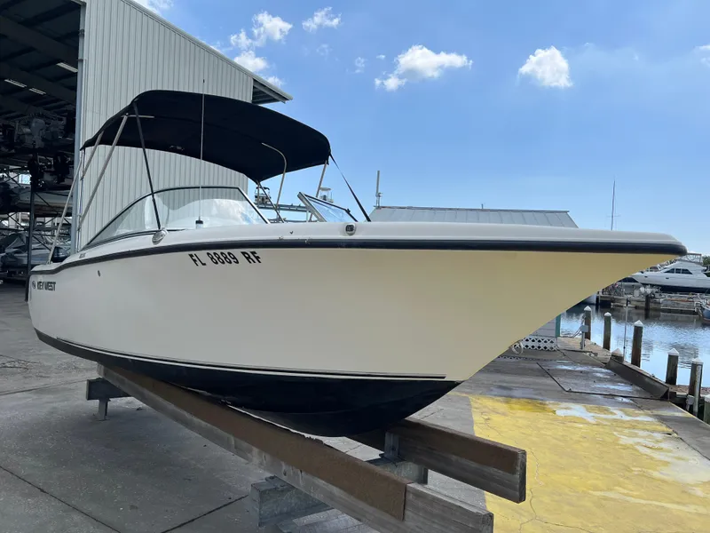 Slide: The Image of 2014 Key West 203 DFS boat docked at a marina. - 1