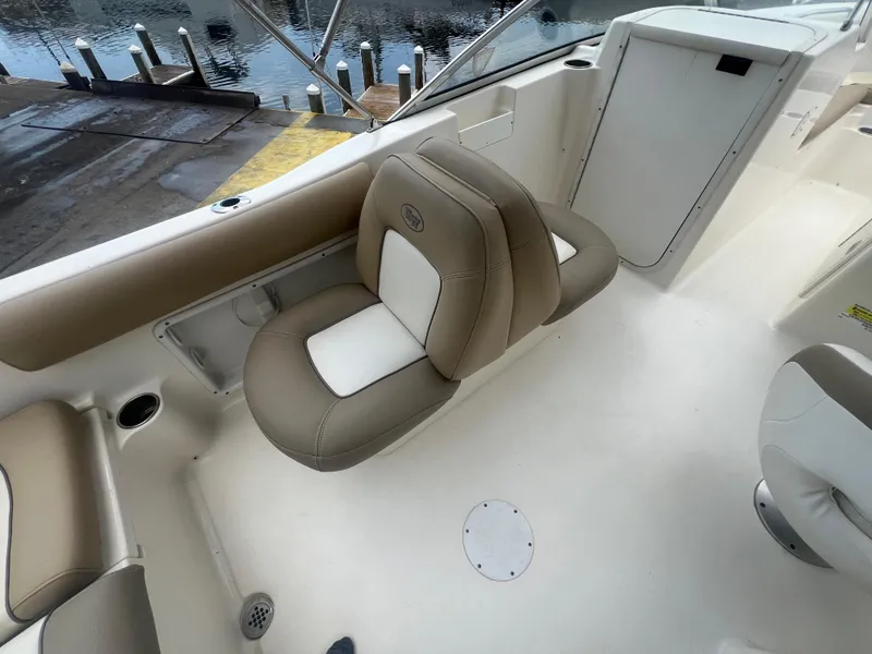 Slide: The Image of 2014 Key West 203 DFS boat interior with beige and white seating. - 10