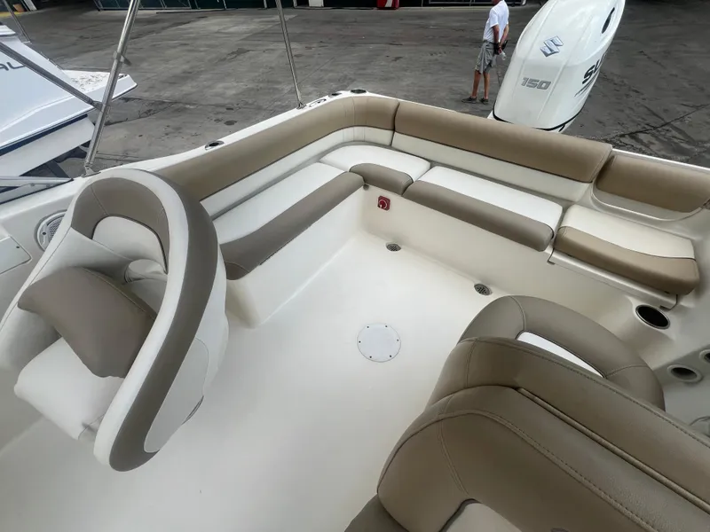 Slide: The Image of 2014 Key West 203 DFS boat interior with beige and white seating. - 12