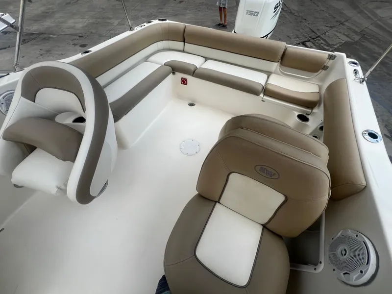 Slide: The Image of 2014 Key West 203 DFS boat interior with beige and white seating. - 13