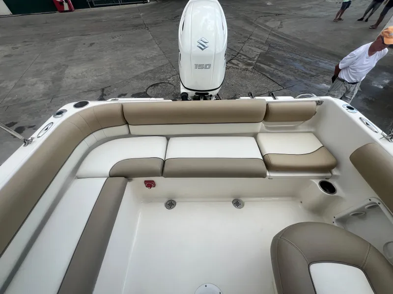 Slide: The Image of 2014 Key West 203 DFS boat with beige seating and Suzuki outboard motor. - 15