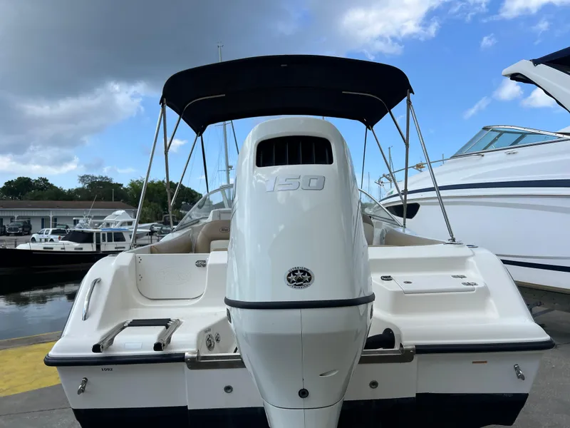 Slide: The Image of 2014 Key West 203 DFS boat with Yamaha 150 outboard motor at marina. - 19