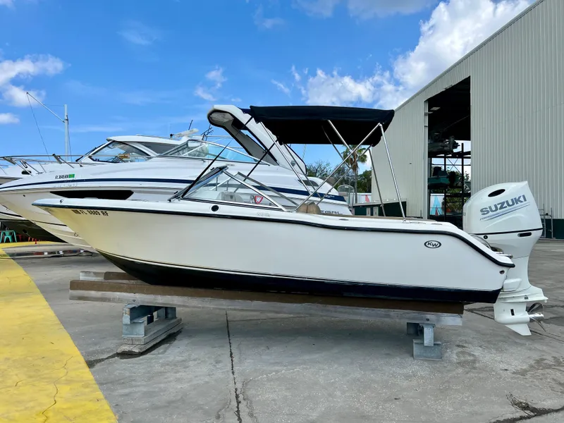 Slide: The Image of 2014 Key West 203 DFS boat with Suzuki outboard motor on dry dock. - 21