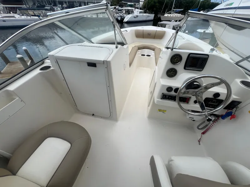 Slide: The Image of 2014 Key West 203 DFS boat interior with steering wheel and seating. - 5