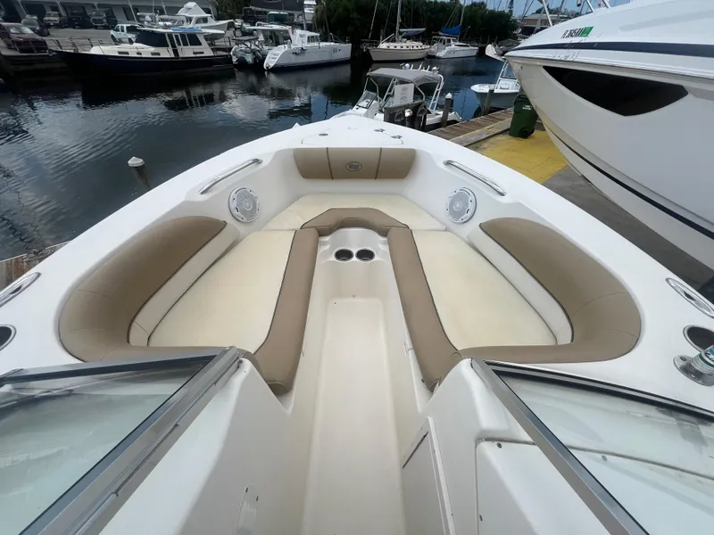 Slide: The Image of 2014 Key West 203 DFS boat with spacious seating at a marina. - 7