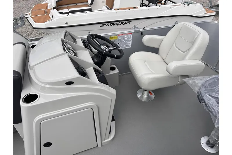 Slide: The Image of 2024 Sylvan Mirage 818 Cruise boat interior with steering console and captain's chair. - 9