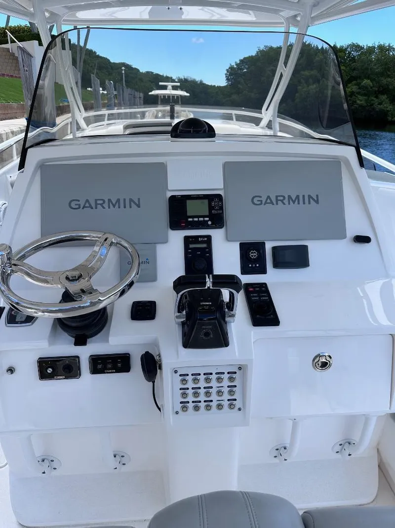 Slide: The Image of 2016 Intrepid 375 Walkaround boat helm with Garmin navigation system. - 11