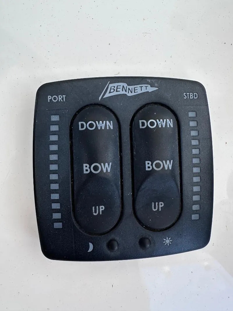 Slide: The Image of Bennett trim tab control panel on 2016 Intrepid 375 Walkaround boat. - 14