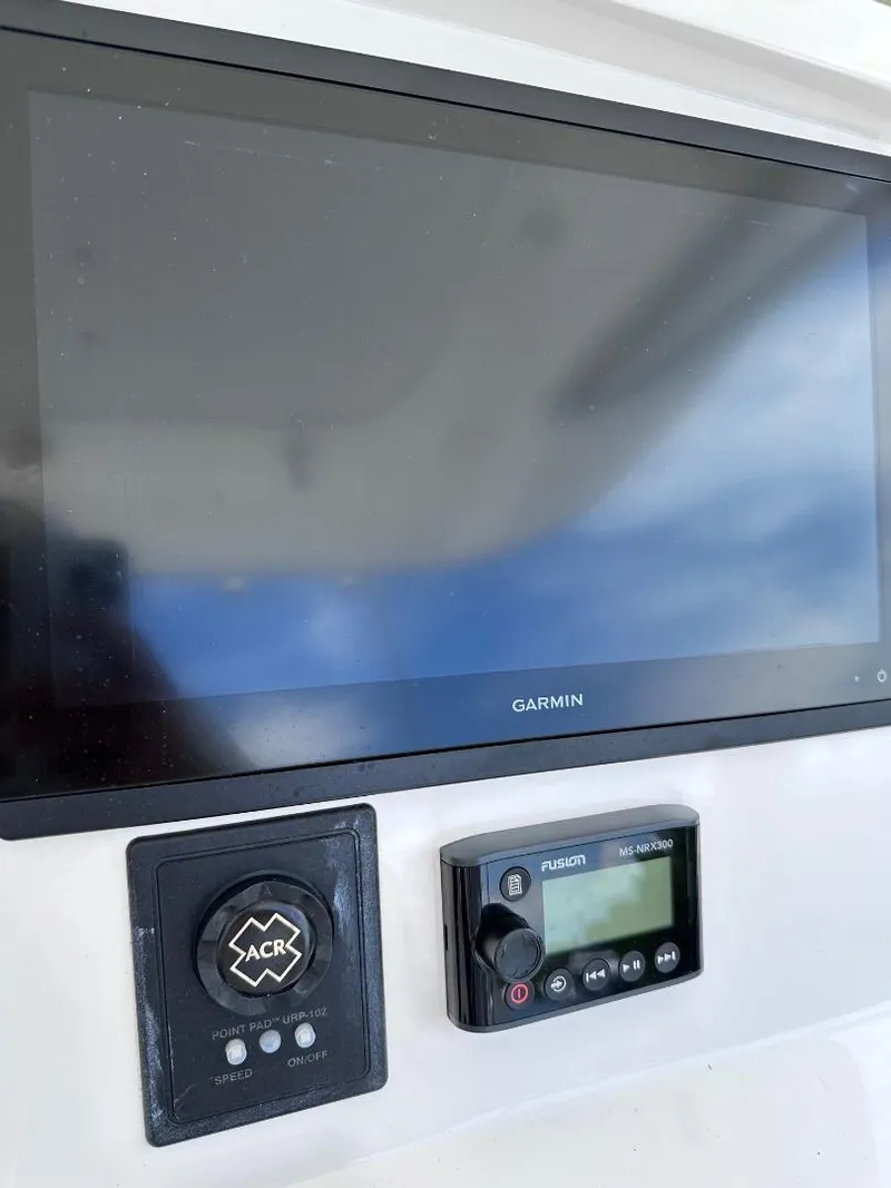 Slide: The Image of Garmin display and controls on a 2016 Intrepid 375 Walkaround boat. - 19