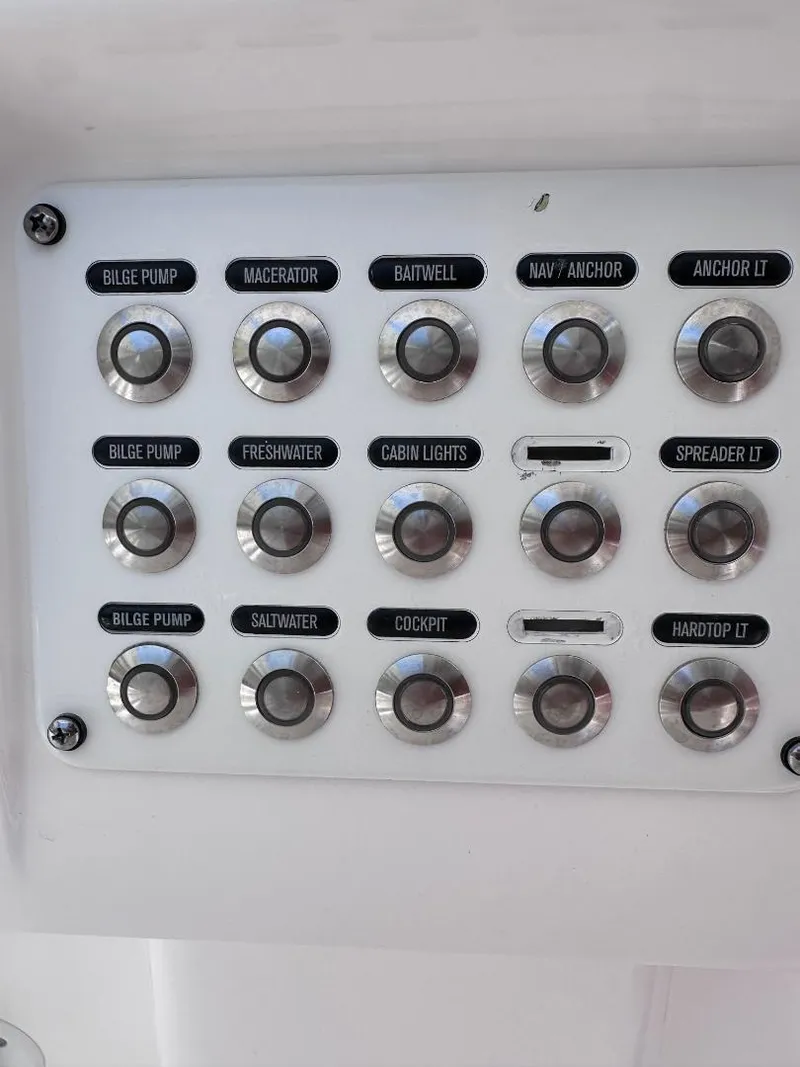 Slide: The Image of Control panel of a 2016 Intrepid 375 Walkaround boat with labeled buttons. - 20