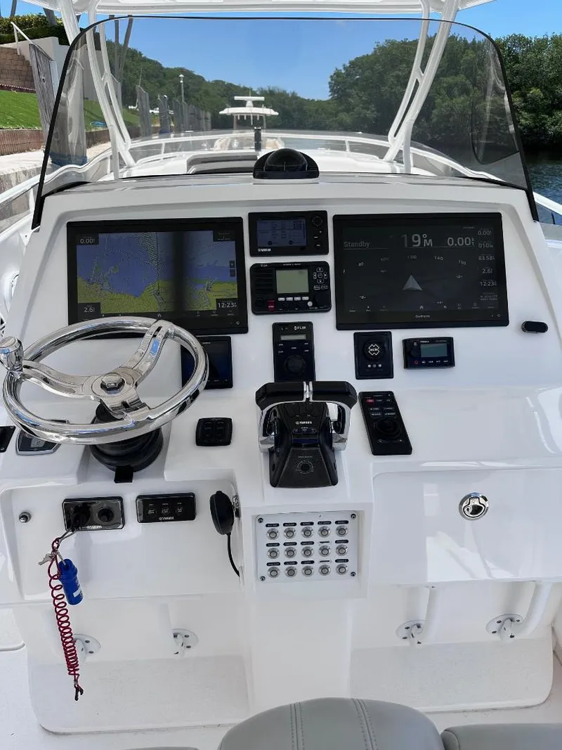 Slide: The Image of 2016 Intrepid 375 Walkaround boat dashboard with navigation and control systems. - 23