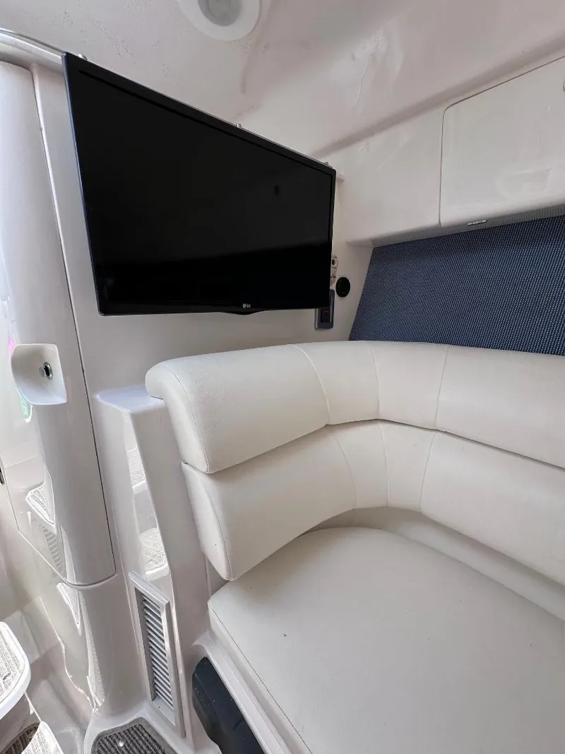 Slide: The Image of 2016 Intrepid 375 Walkaround interior with TV and white leather seating. - 37