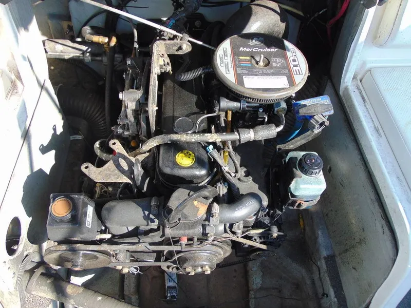 Slide: The Image of 2013 Bayliner 185 Bowrider engine compartment with MerCruiser 3.0L engine. - 1