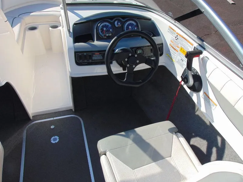 Slide: The Image of 2013 Bayliner 185 Bowrider boat cockpit with steering wheel and dashboard. - 5