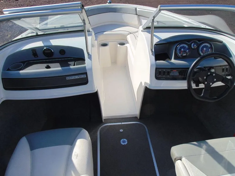 Slide: The Image of 2013 Bayliner 185 Bowrider boat interior with steering wheel and dashboard. - 6
