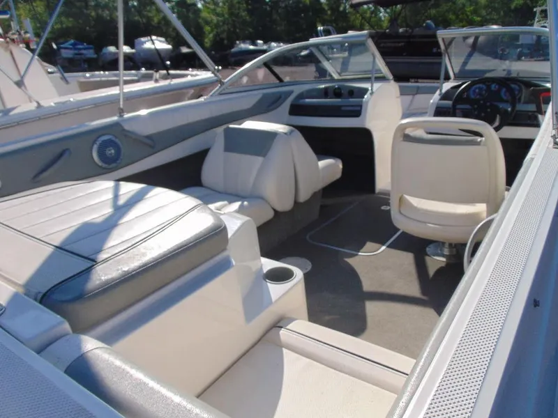 Slide: The Image of 2013 Bayliner 185 Bowrider interior with seating and steering wheel. - 8