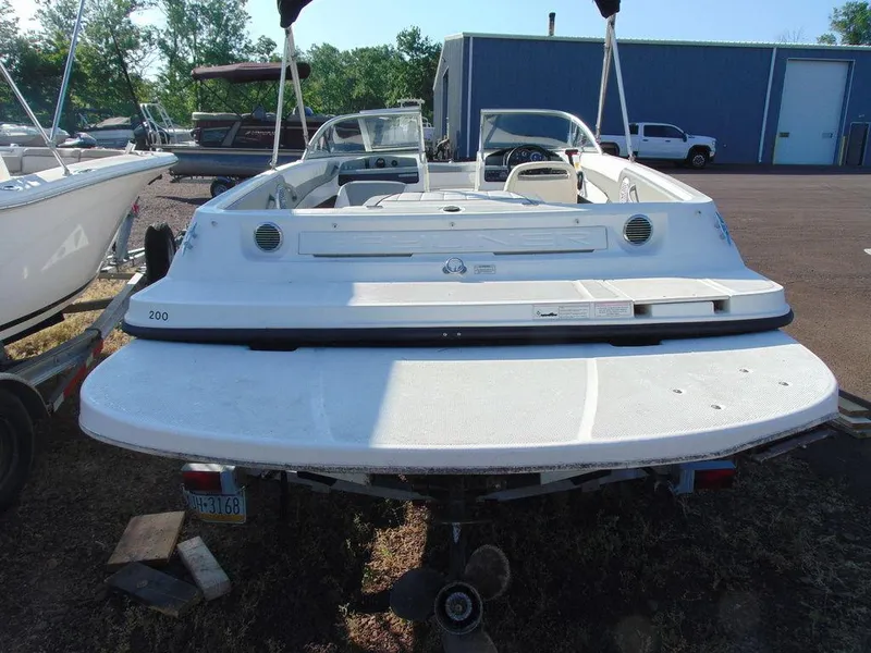 Slide: The Image of 2013 Bayliner 185 Bowrider boat, rear view, parked on a trailer. - 9