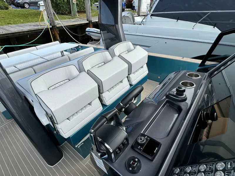 Slide: The Image of Fiart 39 Seawalker 2025 boat interior with modern seating and control panel. - 11