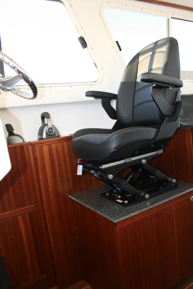 Slide: The Image of Captain's chair in 2025 Ocean Sport Roamer 33' boat interior. - 8