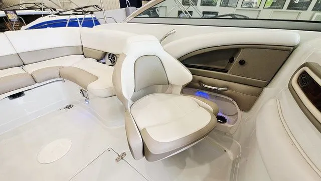 Slide: The Image of Interior of a 2014 Crownline 255 SS boat with beige seating. - 10