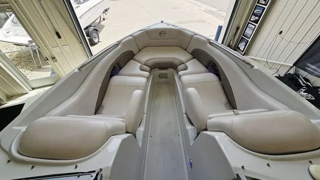 Slide: The Image of Interior view of a 2014 Crownline 255 SS boat with beige seating. - 15