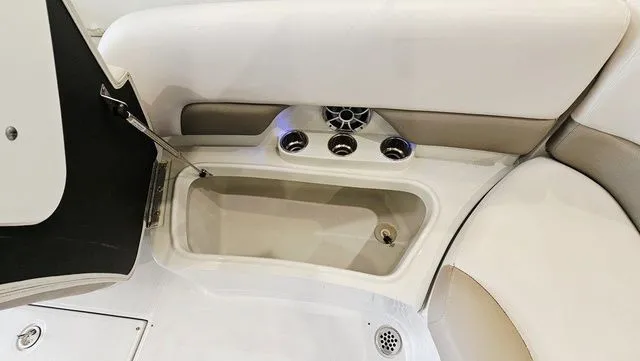 Slide: The Image of Interior of a 2014 Crownline 255 SS boat with cup holders. - 25