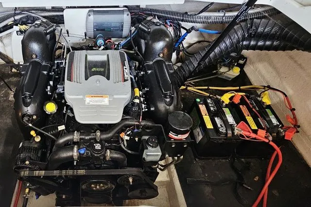 Slide: The Image of Engine compartment of a 2014 Crownline 255 SS boat with batteries. - 27