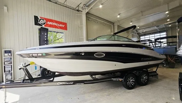 Slide: The Image of 2014 Crownline 255 SS boat in a showroom. - 3