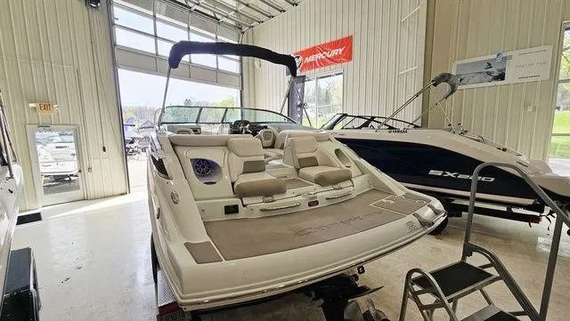 Slide: The Image of 2014 Crownline 255 SS boat in showroom. - 4