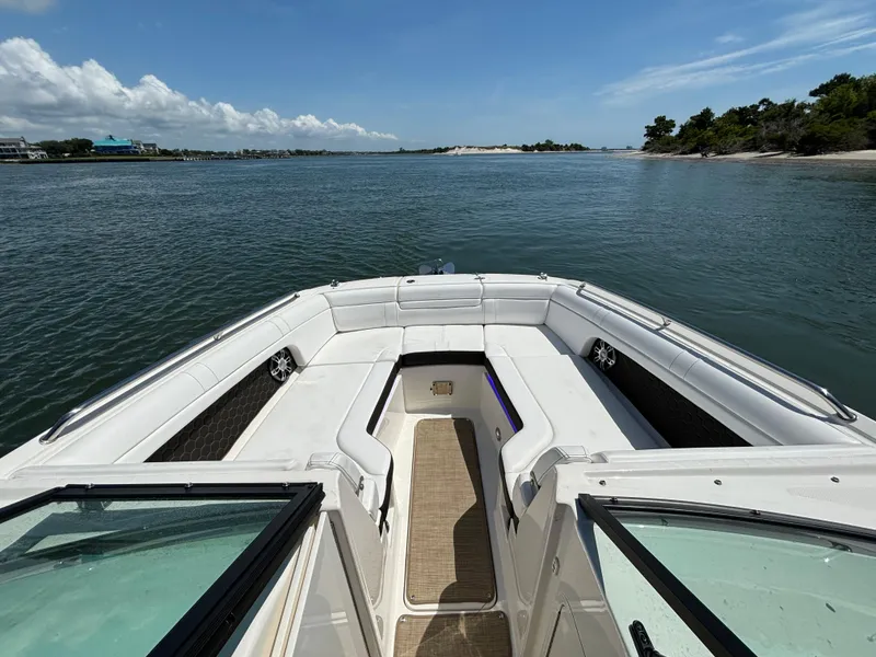 Slide: The Image of 2023 Sea Ray SDX 270 Outboard boat interior with scenic water view. - 14