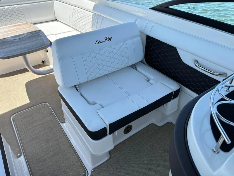 Slide: The Image of 2023 Sea Ray SDX 270 Outboard interior seating and table. - 26