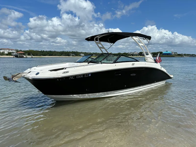 Slide: The Image of 2023 Sea Ray SDX 270 Outboard boat anchored in shallow water. - 3