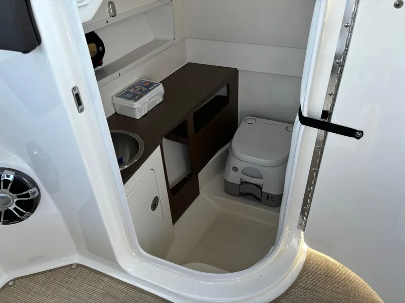 Slide: The Image of Interior of 2023 Sea Ray SDX 270 Outboard boat with sink and portable toilet. - 41