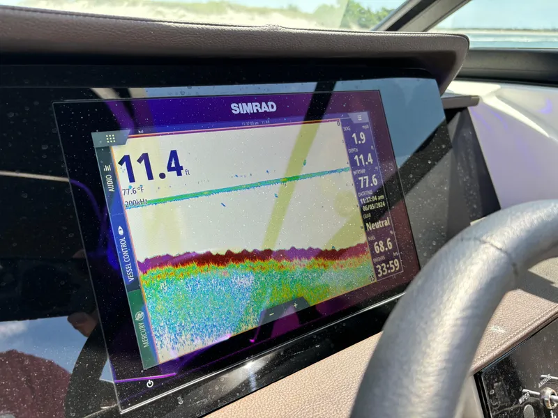 Slide: The Image of Simrad display on 2023 Sea Ray SDX 270 Outboard showing depth and water temperature. - 46