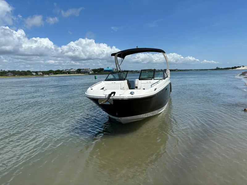 Slide: The Image of 2023 Sea Ray SDX 270 Outboard boat anchored in shallow water on a sunny day. - 5