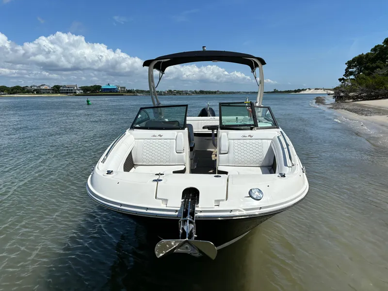 Slide: The Image of 2023 Sea Ray SDX 270 Outboard boat docked on a sunny beach. - 6