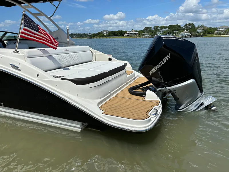 Slide: The Image of 2023 Sea Ray SDX 270 Outboard boat with Mercury engine on calm water. - 8
