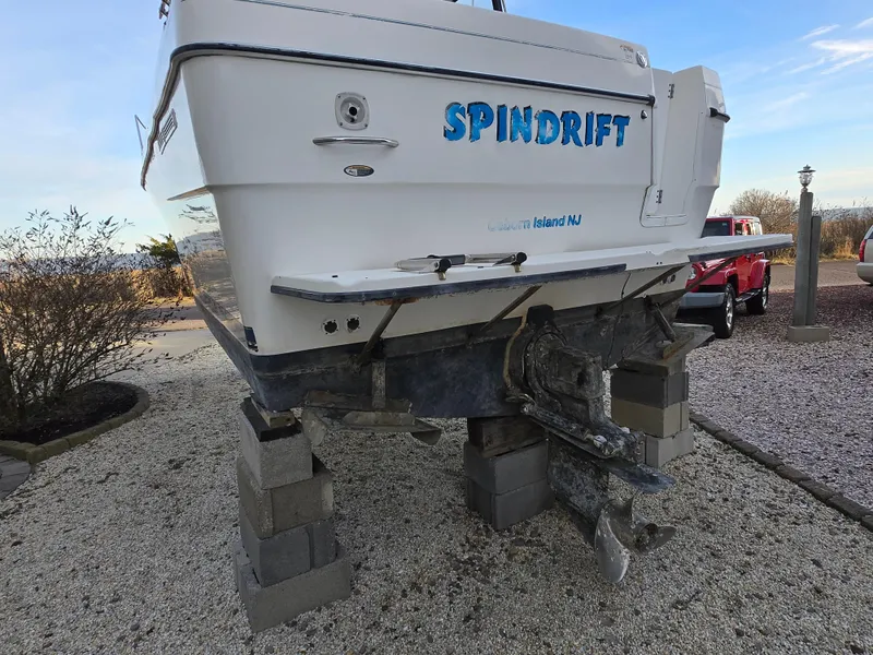 Slide: The Image of Bayliner 2859 Ciera Express 2000 on blocks, rear view, "Spindrift" name visible. - 31